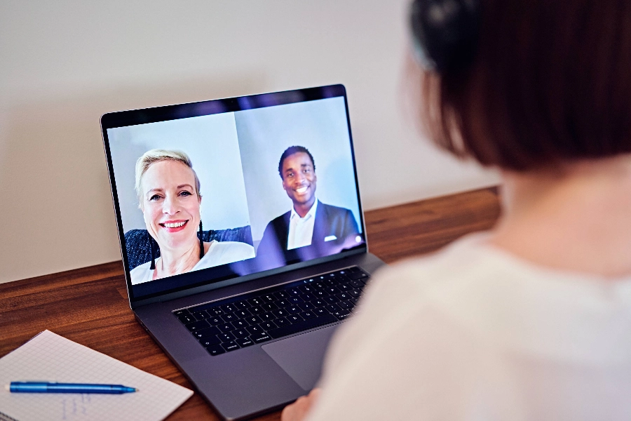 Three employees in a remote meeting