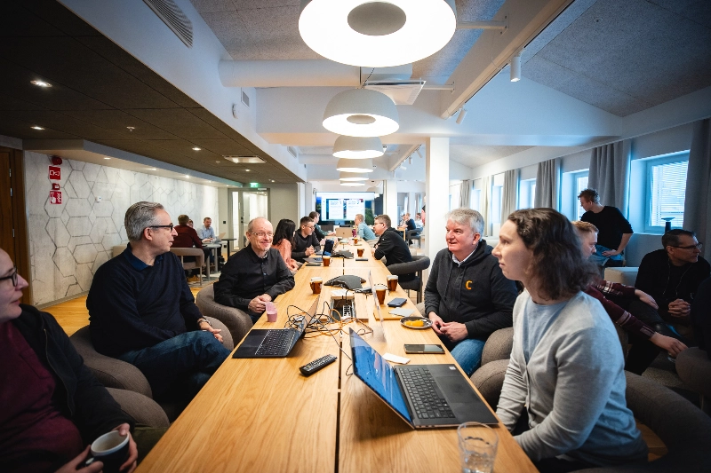 The Codento team in a meeting around a long table The Codento team in a meeting around a long table
