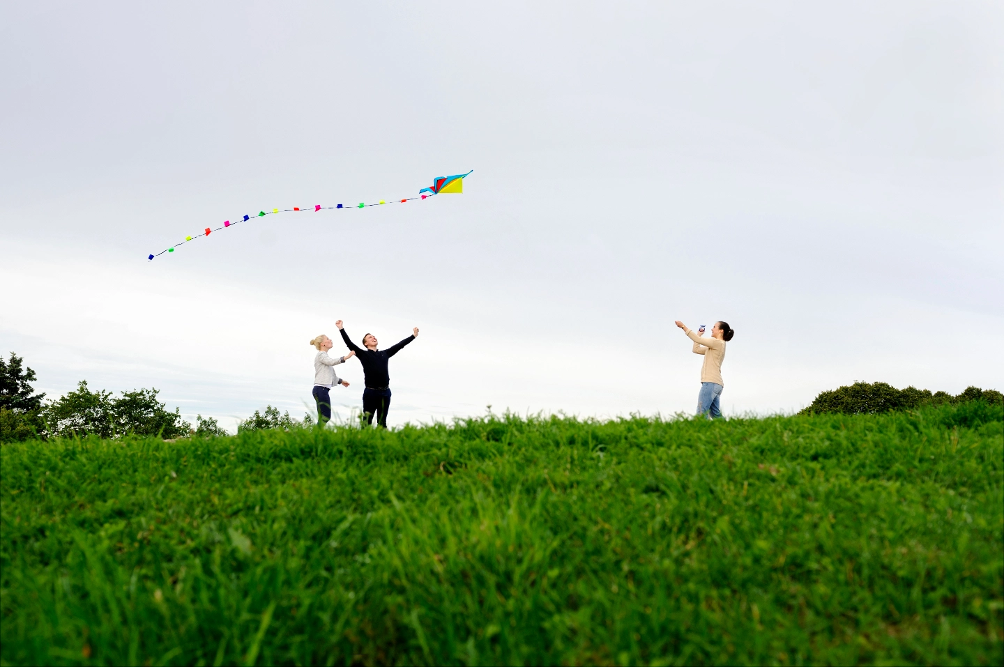 A group of people are flying kite A group of people are flying kite