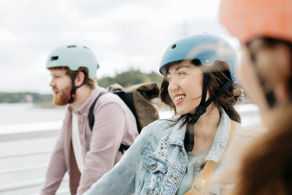 Three people wearing bike helmets - kuva: Elina Manninen Three people wearing bike helmets - kuva: Elina Manninen