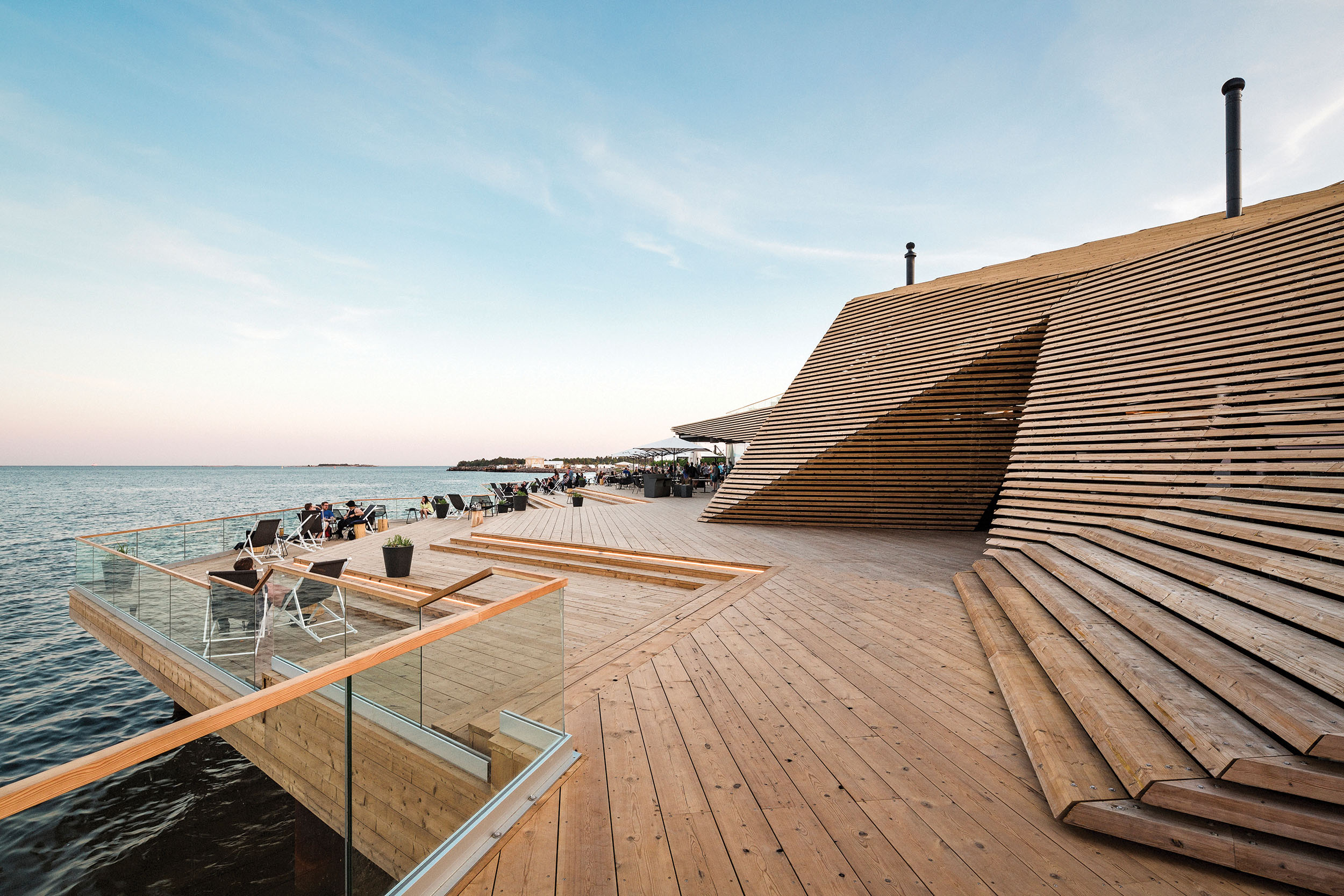 An architecturally impressive sauna building on the shores of the Baltic Sea in Helsinki.