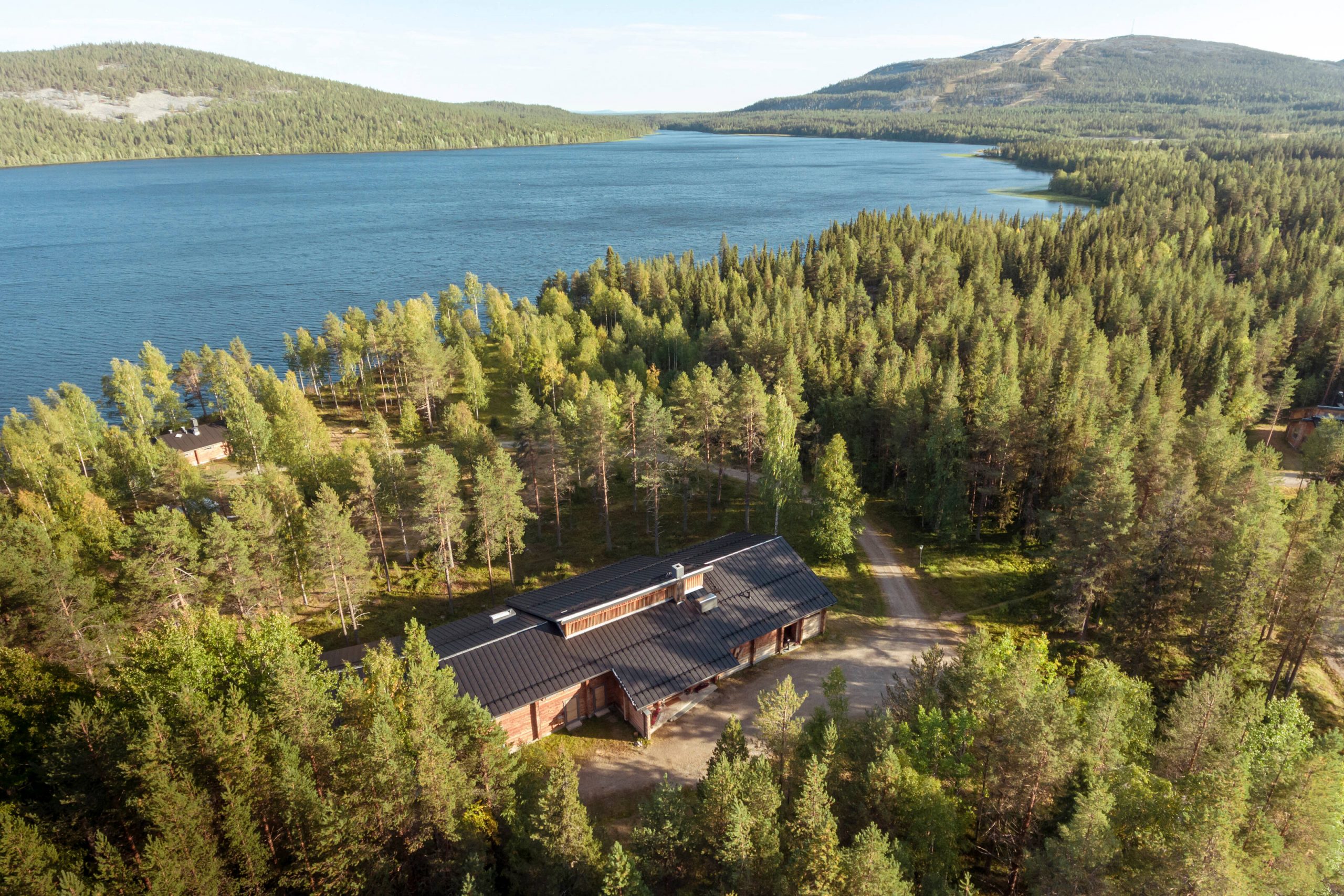 An aerial view of a resort in a private forest setting in Finnish Lapland.