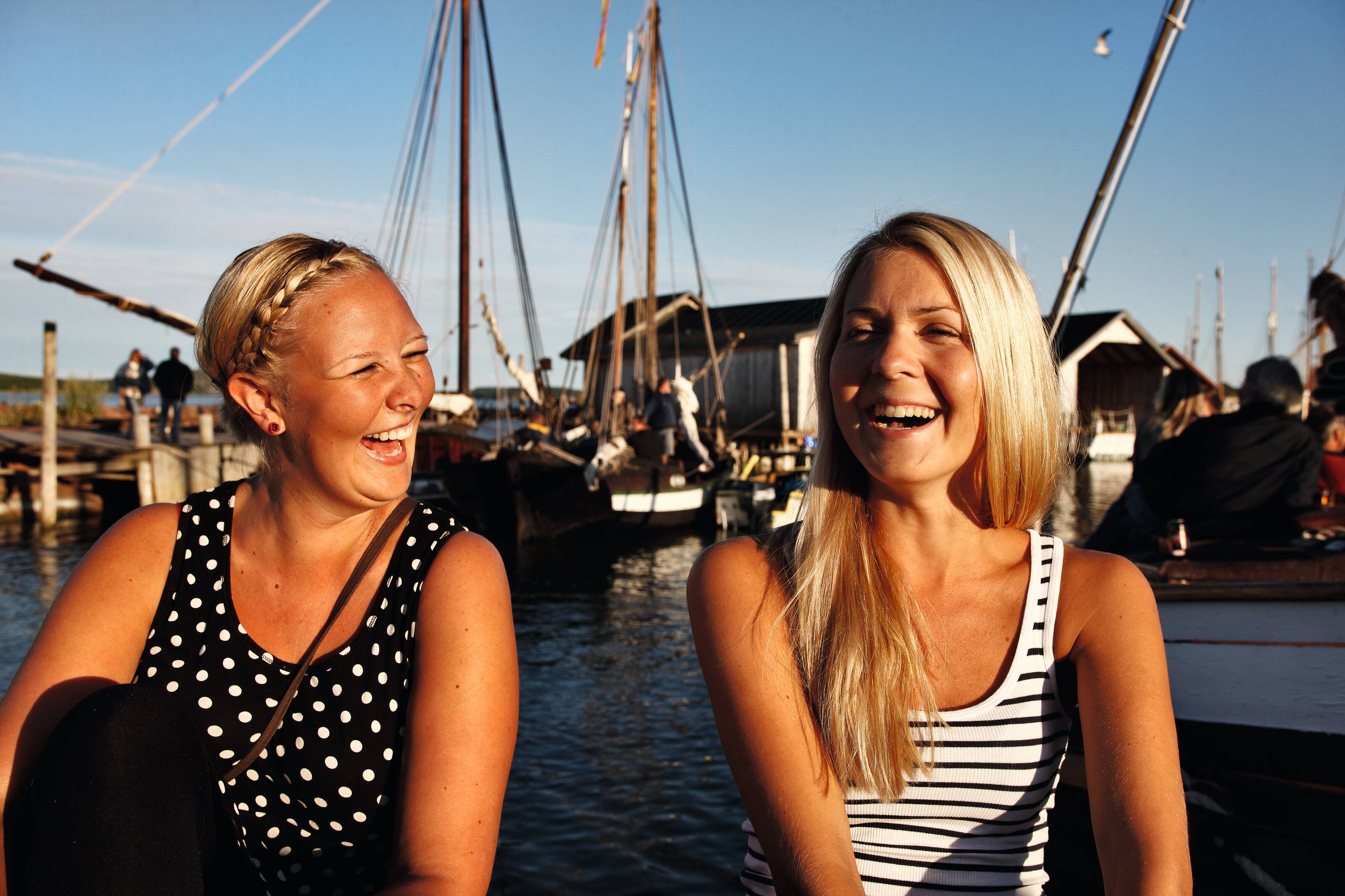 two women laughing at Marina in Åland archipelago