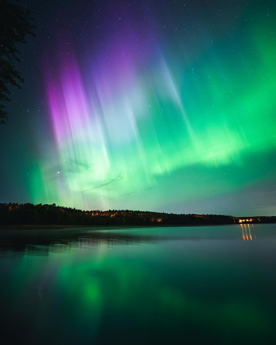 Northern lights over a lake.