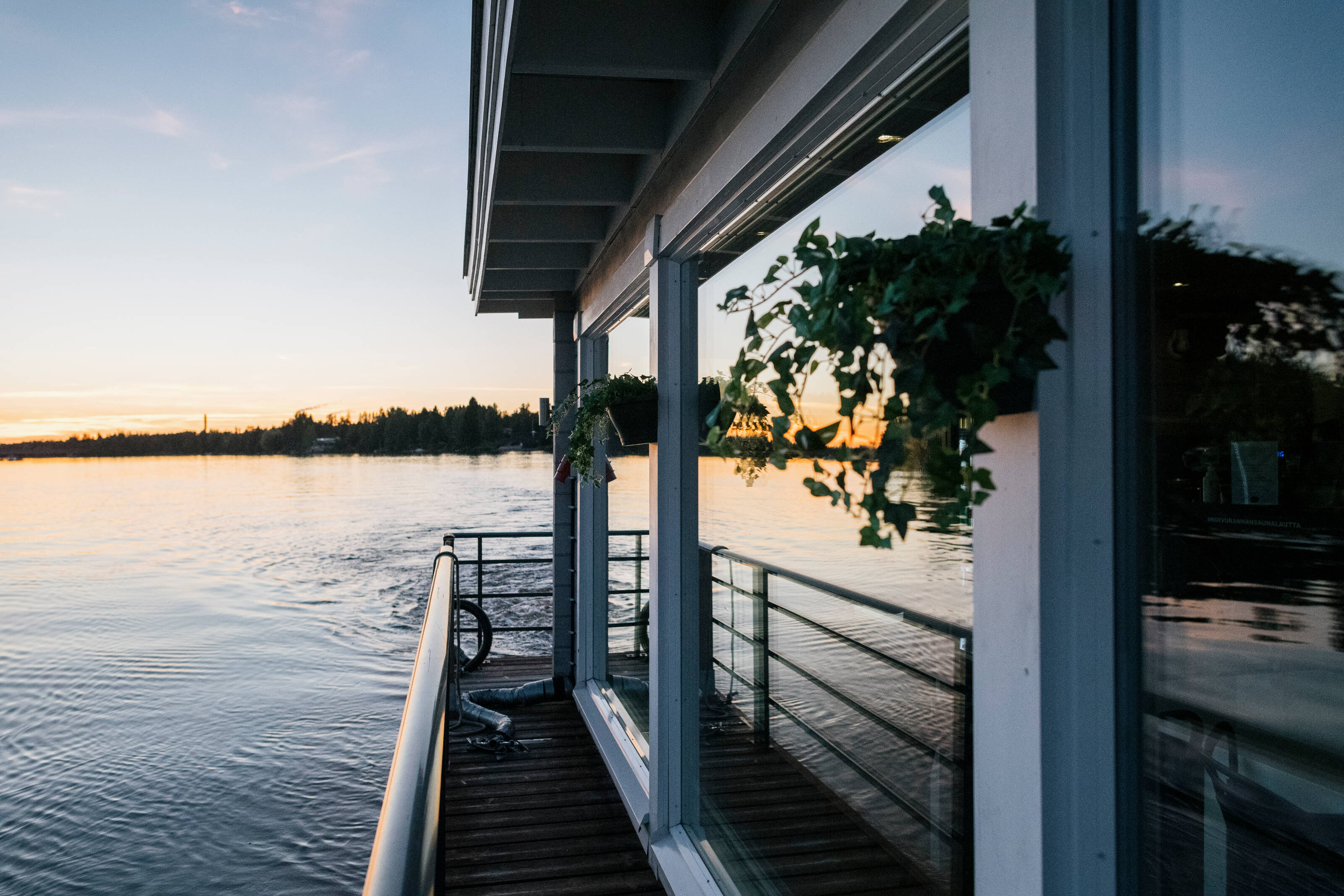 Koivuranta sauna ferry floating on top of water in Oulu.