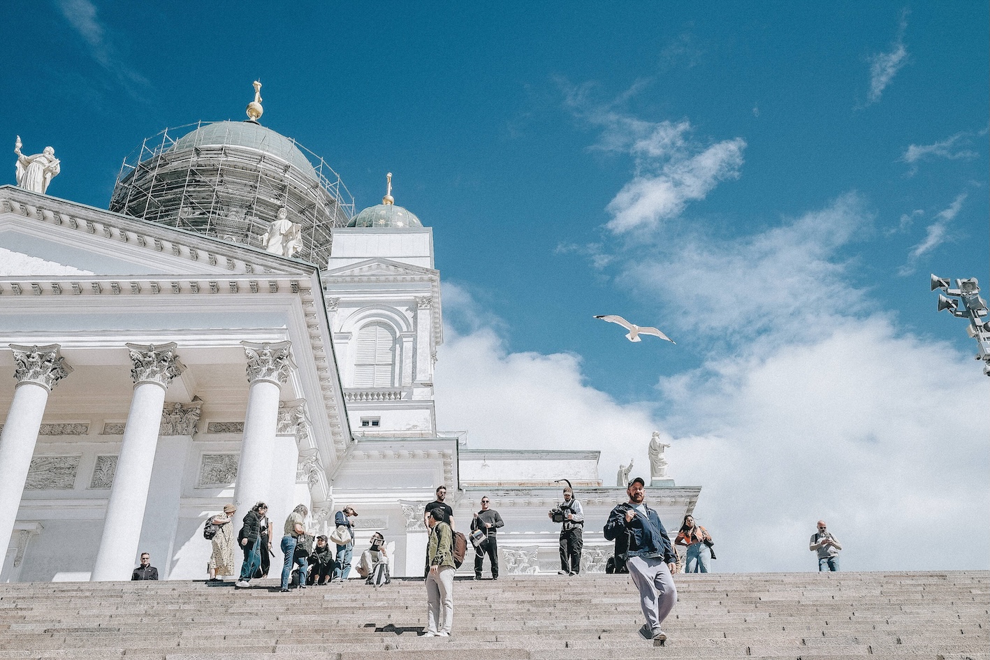 People standing in front of the Helsinki Cathedral in the summer. People standing in front of the Helsinki Cathedral in the summer.