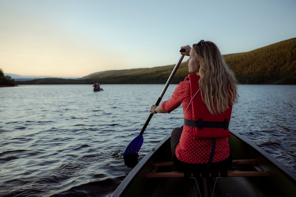 Kayaker on the Teno River in Utsjoki, Finnish Lapland. - Kota Collective