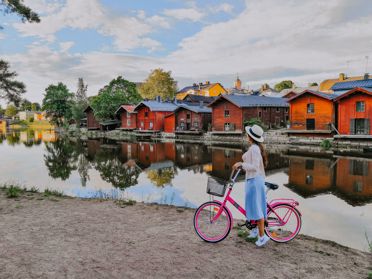 Colorful wooden houses lining the riverside in Old Porvoo. - Julia Kivelä