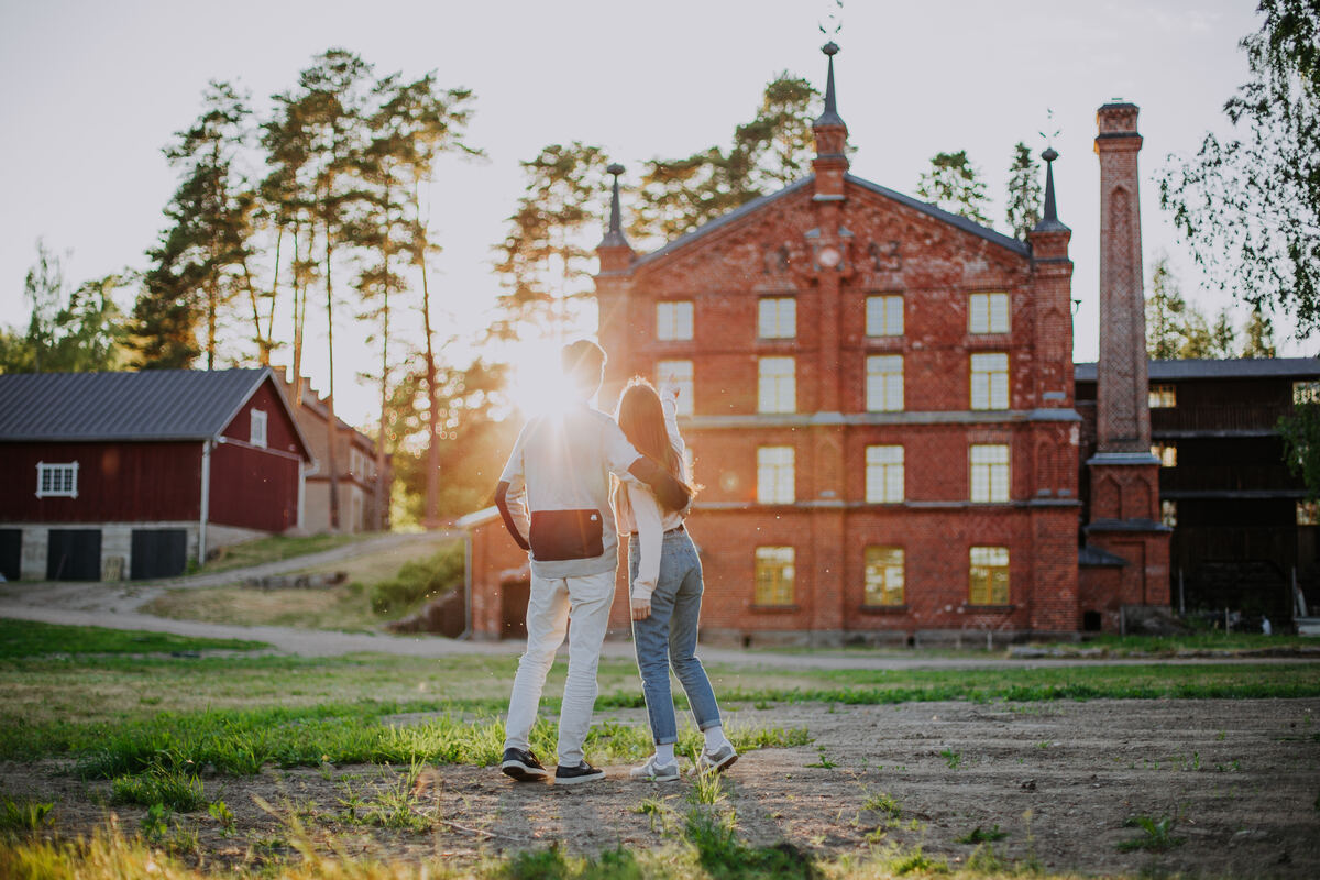 The Verla Mill Museum's sunlit exterior on a clear day. - Julia Kivelä